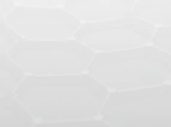 A close-up of a white fabric or material surface with a subtle hexagonal pattern.